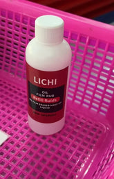White plastic bottle of oil film eraser makeup remover in a pink mesh basket