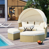 Modern outdoor patio set with beige wicker sectional sofa, cream cushions, canopy, and matching ottomans