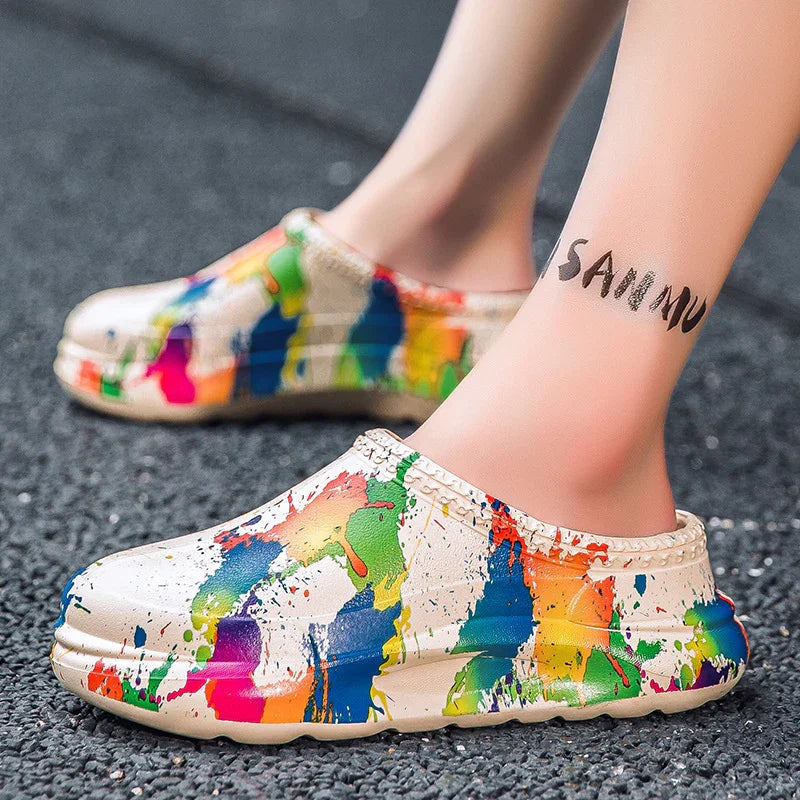 Beige slip-on clogs with colorful paint splatter design, casual streetwear style