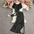 Black floral print short sleeve jumpsuit with wide-leg pants, lightweight fabric, relaxed fit