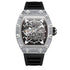 Skeleton dial luxury wristwatch with silver case, crystal accents, and black rubber strap