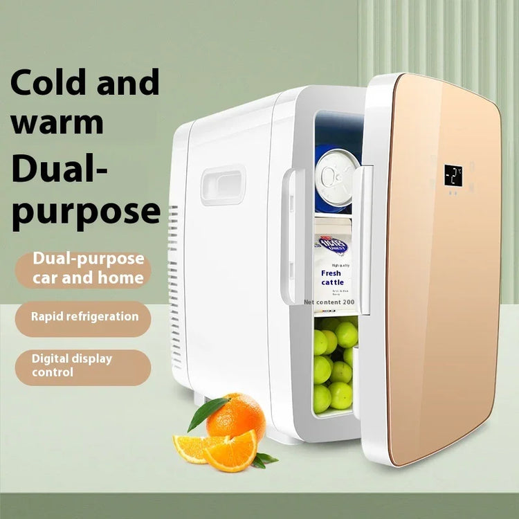 Compact white and gold mini fridge with digital display, storing drinks and fruit, on countertop.
