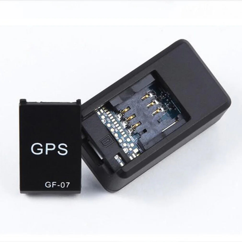 Compact black GPS tracking device with removable cover and visible SIM card slot