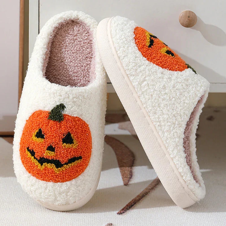 Fuzzy white slippers with orange jack-o&