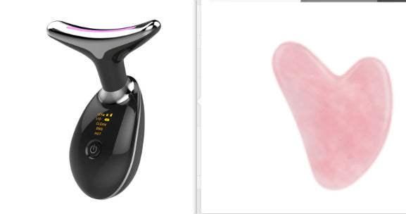 Black electric facial massager and pink gua sha stone on white background