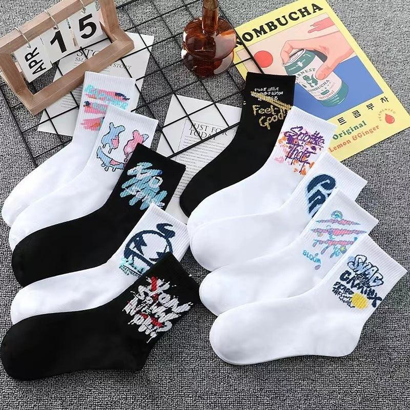 Assorted white and black crew socks with colorful graphic patterns, casual streetwear style
