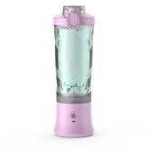 Portable pink blender with clear container, plastic body, and power button, isolated on white