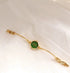 Gold bracelet watch with green dial, slim chain band, elegant minimalist jewelry style