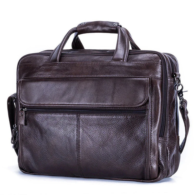 Brown leather messenger bag with zipper pockets and adjustable shoulder strap, structured fit