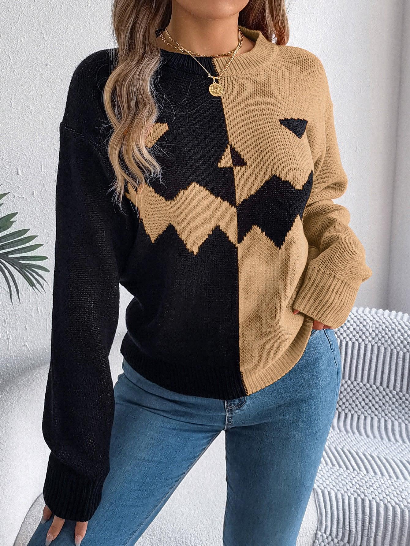 Colorblock black and beige knit sweater with pumpkin face design, relaxed fit, paired with jeans