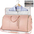 Light pink faux leather weekender bag with gold zippers and garment storage section