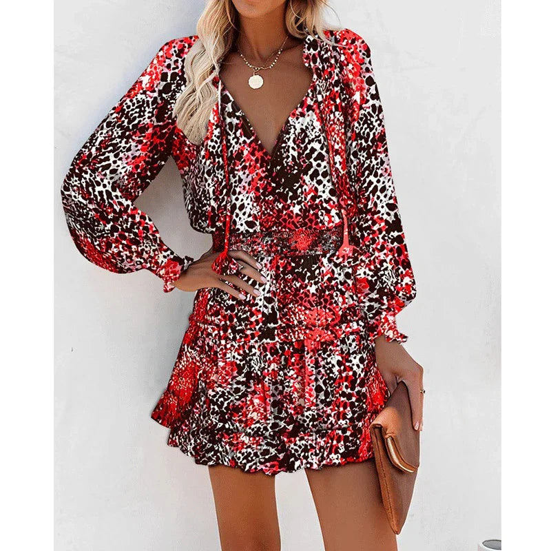 Woman in a red and black animal print long sleeve mini dress with relaxed fit and flowy skirt