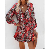 Woman in a red and black animal print long sleeve mini dress with relaxed fit and flowy skirt