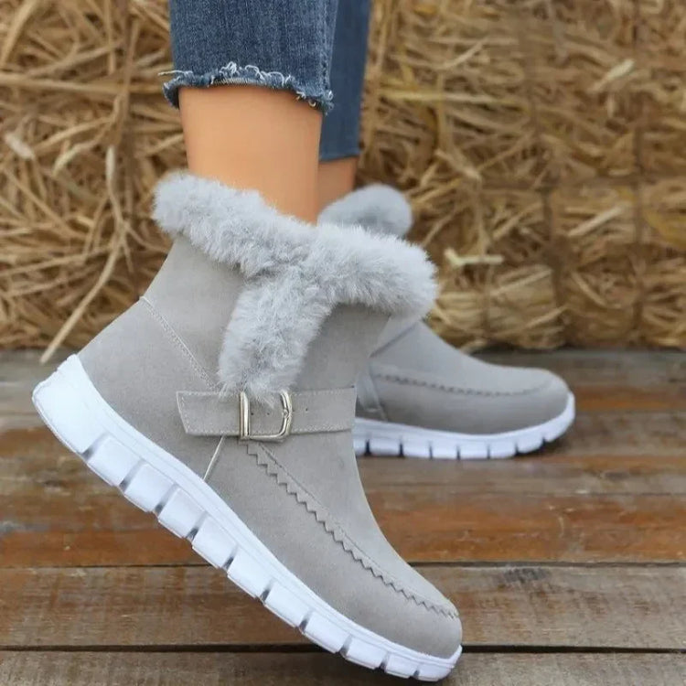 Light grey faux fur ankle boots with suede finish, white rubber sole, and casual fit