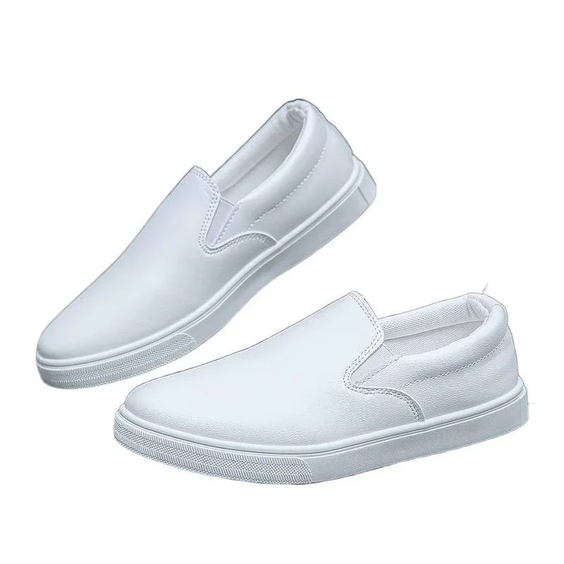 White slip-on sneakers with minimalist design and low-top fit, synthetic upper material