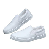 White slip-on sneakers with minimalist design and low-top fit, synthetic upper material
