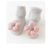 Gray ribbed baby socks with soft pink flower appliqué, cozy cotton knit, ankle length.