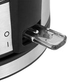 Close-up of metallic appliance with transparent pull-out tray and black accents