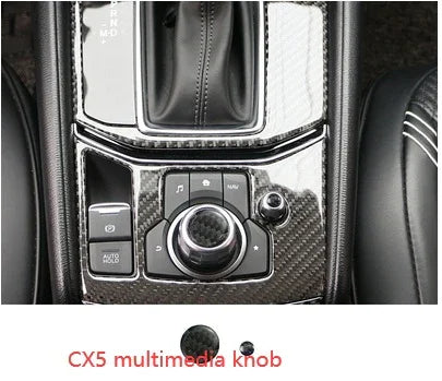 Carbon fiber CX5 multimedia control knob and buttons on black car console