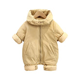 Beige puffer infant jumpsuit with rolled cuffs, zipper closure, and cozy high collar.