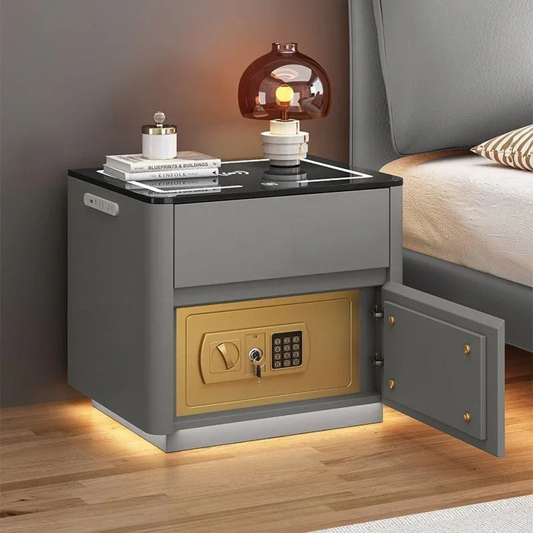 Modern grey nightstand with black glass top, built-in gold safe, and ambient LED lighting