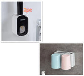Wall-mounted bathroom organizer set with two pastel plastic cups and toothbrush holder