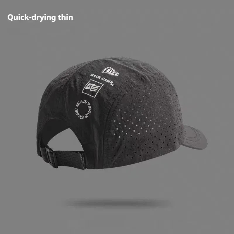Black quick-drying perforated cap with adjustable strap and minimalist sporty design.
