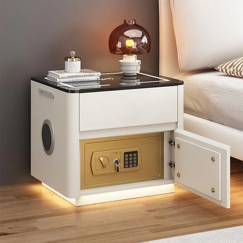 Modern white bedside table with black glass top, built-in gold safe, and LED lighting