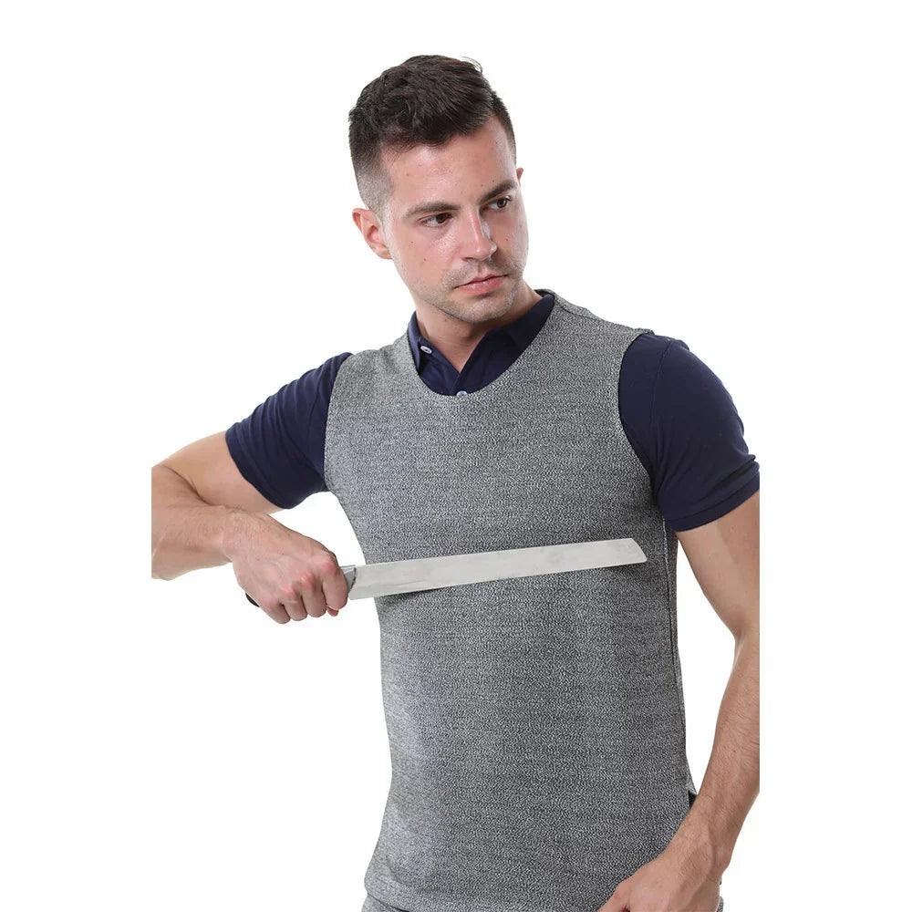 Man wearing a gray sleeveless protective vest over a navy collared shirt, showing cut-resistant clothing fit and texture.