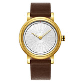 Gold-tone wristwatch with brown leather strap and engraved silver dial displaying unique text prompts.