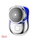 Compact silver electric shaver with circular blade and blue accent, sleek ergonomic design