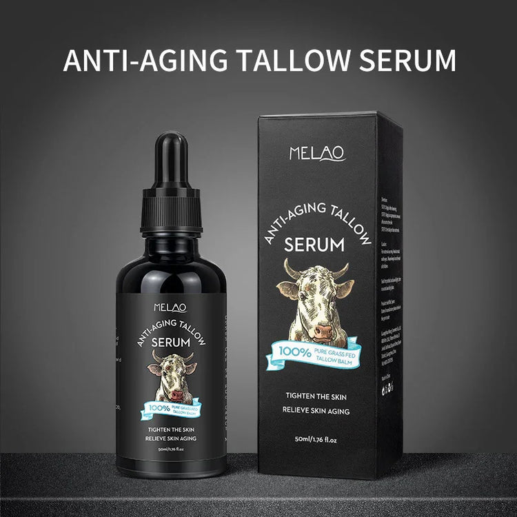 Black dropper bottle and box of anti-aging tallow serum with cow graphic, skincare product
