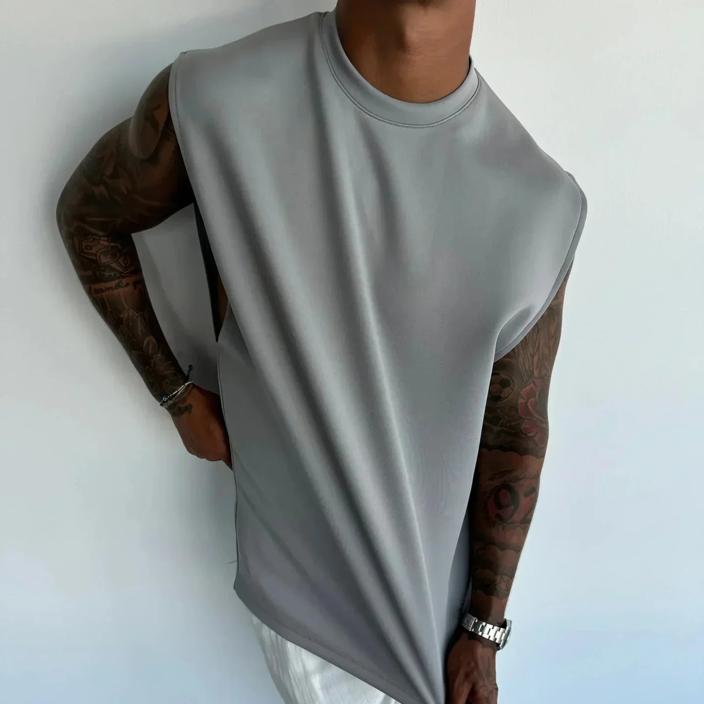 Men's oversized sleeveless gray muscle shirt with relaxed fit and smooth fabric