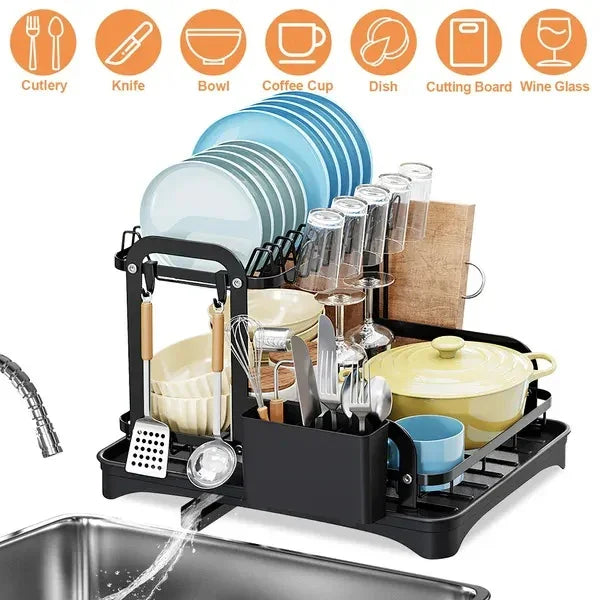 Black metal dish drying rack with multiple tiers holding plates, bowls, mugs, utensils, and glasses.