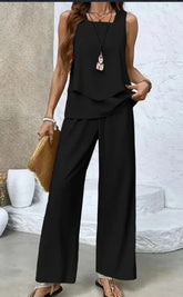 Woman wearing black sleeveless loose-fit two-piece pants set, lightweight flowy fabric