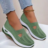 Green knit slip-on sneakers with white soles, breathable mesh design, casual fit
