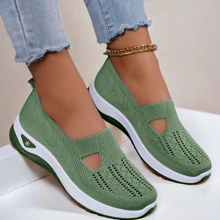 Green knit slip-on sneakers with white soles, breathable mesh design, casual fit