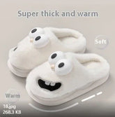 White plush slippers with cartoon face, thick soft material, cozy slip-on fit.