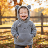 Adorable baby bear hoodie with soft fleece fabric, cute ears on hood, and functional pockets for toddlers