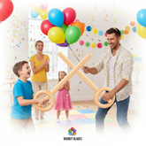 Balloon fencing game with wooden handles and colorful balloons, family playing together at party